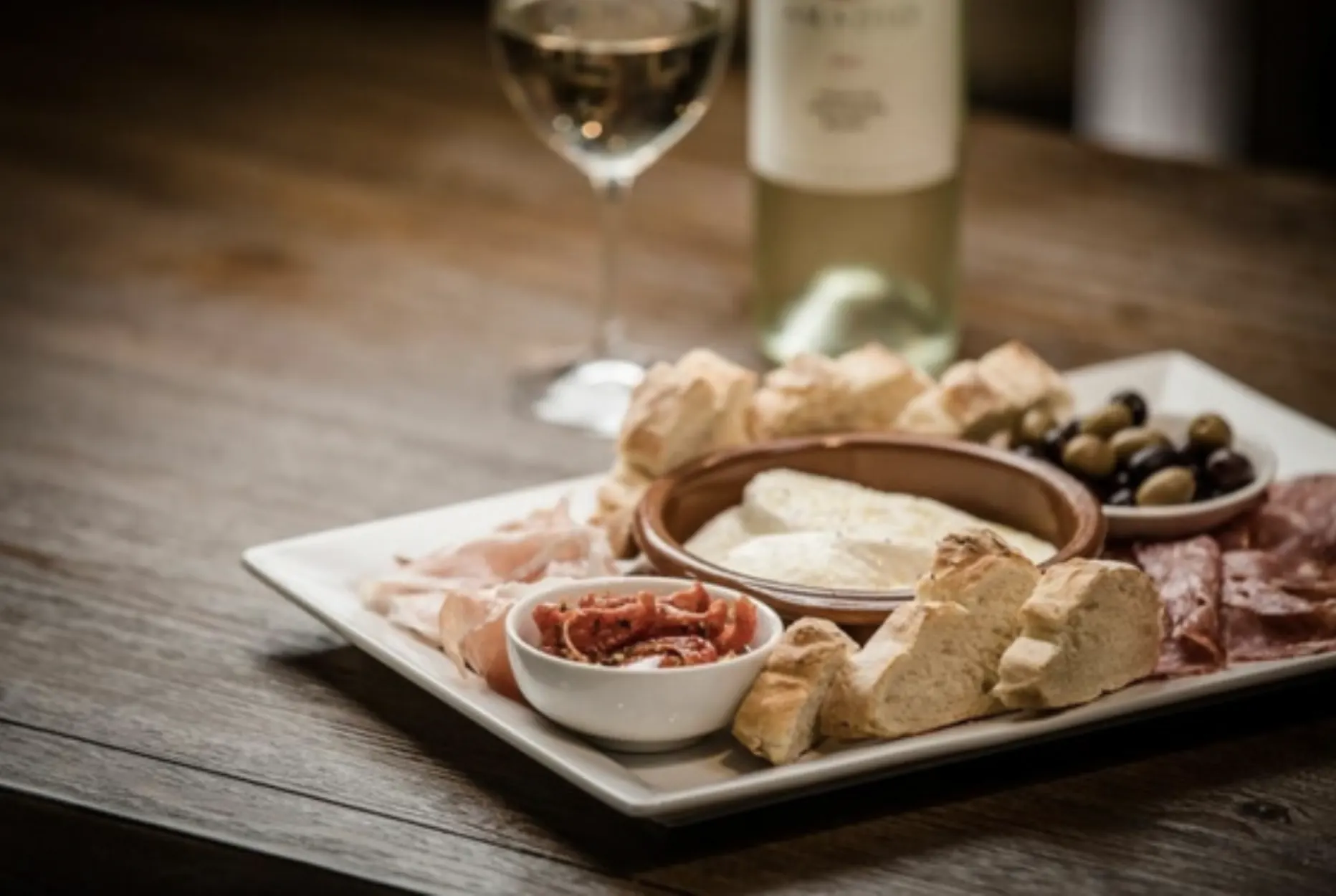 Antipasto platter with wine